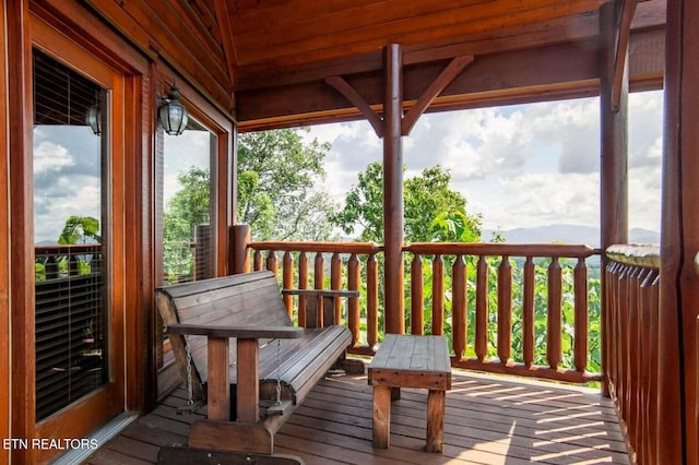 wooden deck with a mountain view