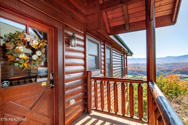 view of exterior entry with a mountain view