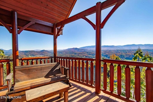 wooden terrace featuring a mountain view