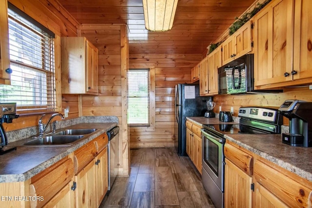 kitchen with black appliances, wooden walls, wood ceiling, and a sink