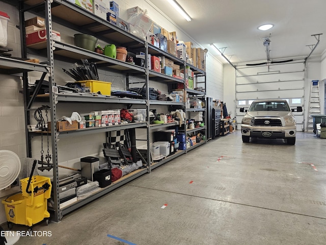 garage featuring concrete block wall