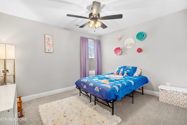 carpeted bedroom featuring a ceiling fan and baseboards