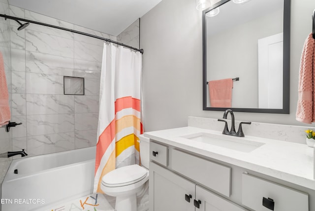 bathroom with vanity, toilet, and shower / bath combo with shower curtain