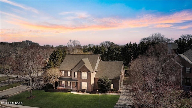 traditional home with a front lawn