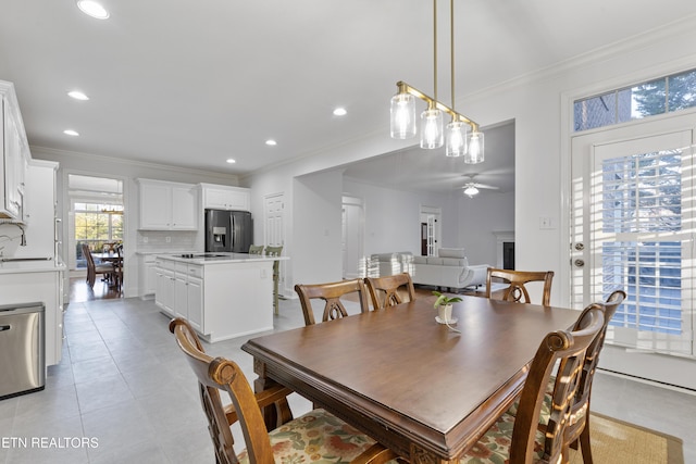 dining space featuring recessed lighting, light tile patterned flooring, ornamental molding, and a ceiling fan