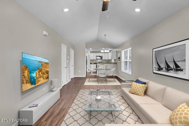 living area featuring a ceiling fan, wood finished floors, baseboards, recessed lighting, and vaulted ceiling