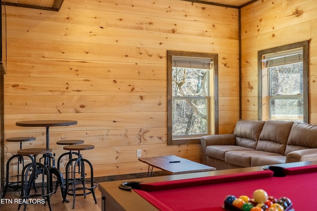 playroom with wooden walls, billiards, and wood finished floors