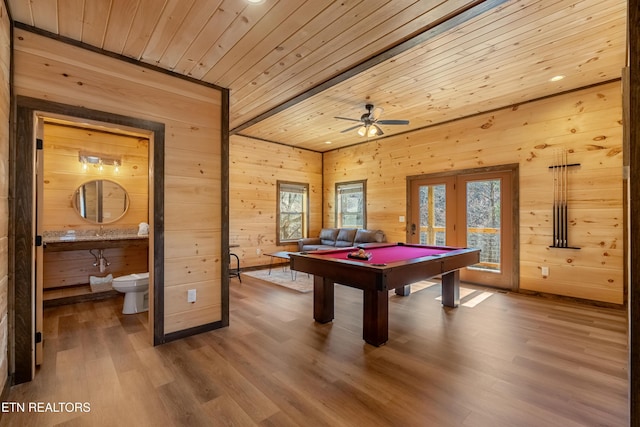 playroom featuring pool table, wood finished floors, wooden ceiling, and wood walls