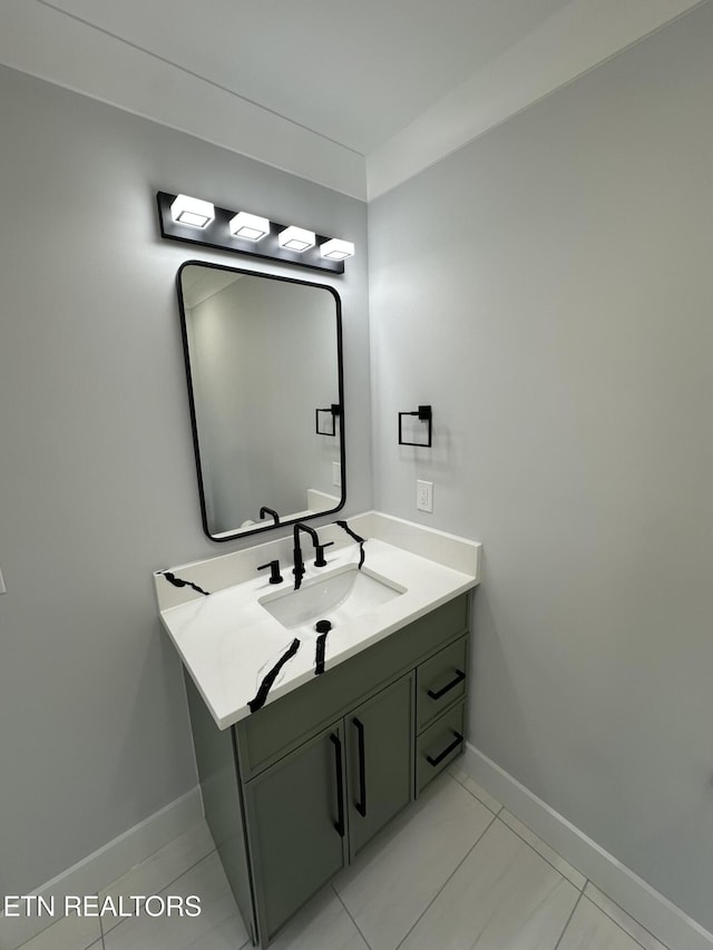 bathroom with vanity and baseboards