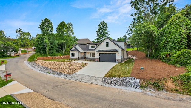 113 Nuhya Way, Loudon, TN 37774 - modern farmhouse style home with driveway and an attached garage