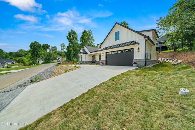 113 Nuhya Way, Loudon, TN 37774 - modern inspired farmhouse with driveway, a front lawn, a standing seam roof, a garage, and board and batten siding