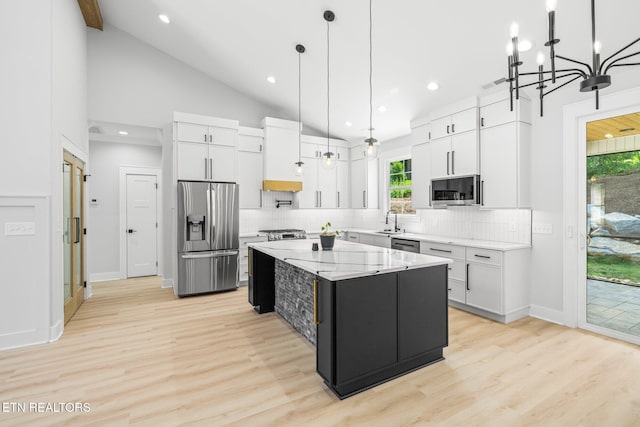 113 Nuhya Way, Loudon, TN 37774 - kitchen featuring stainless steel appliances, decorative backsplash, white cabinets, a kitchen island, and recessed lighting