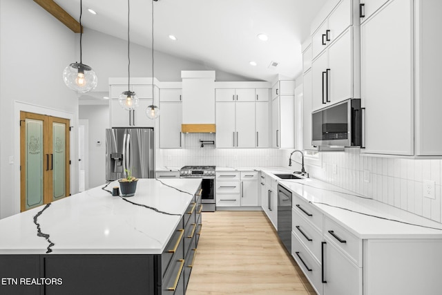 113 Nuhya Way, Loudon, TN 37774 - kitchen featuring stainless steel appliances, vaulted ceiling, a center island, recessed lighting, and custom range hood