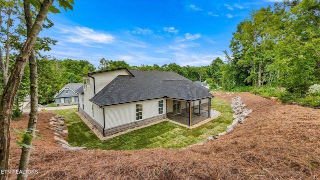 113 Nuhya Way, Loudon, TN 37774 - back of property with a sunroom, roof with shingles, a lawn, and a patio area