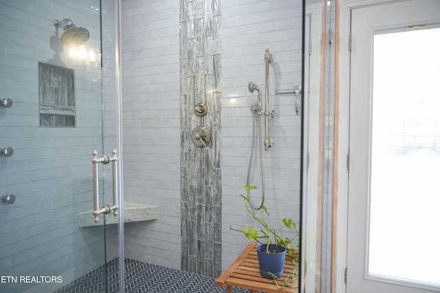 bathroom featuring a shower stall