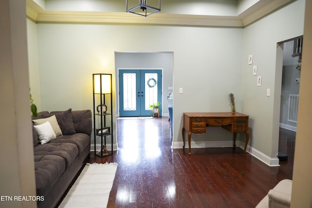 entrance foyer featuring visible vents, wood finished floors, french doors, a high ceiling, and baseboards