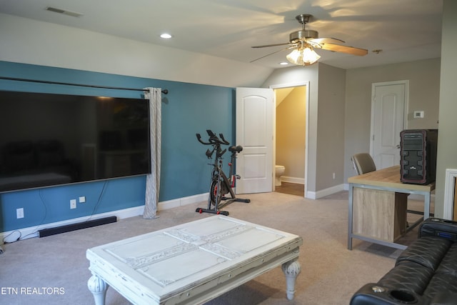 living area featuring visible vents, baseboards, light carpet, and a ceiling fan