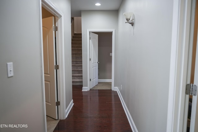 hall with recessed lighting, baseboards, wood finished floors, and stairs