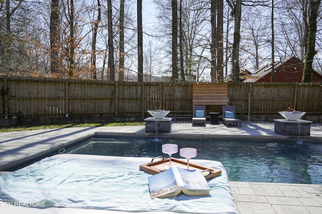 view of pool with a fenced backyard and a fenced in pool