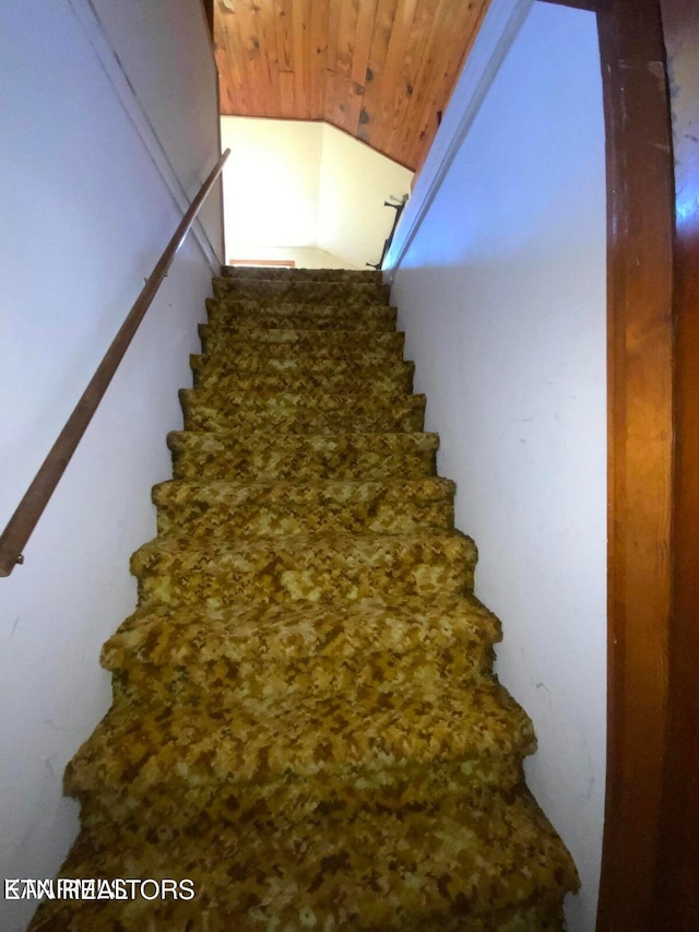 stairway featuring wood ceiling