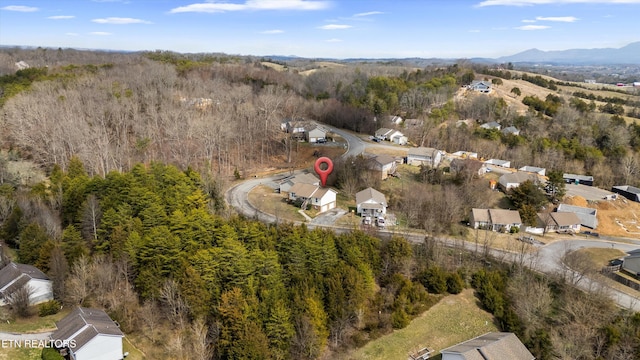 aerial view featuring a mountain view and a wooded view