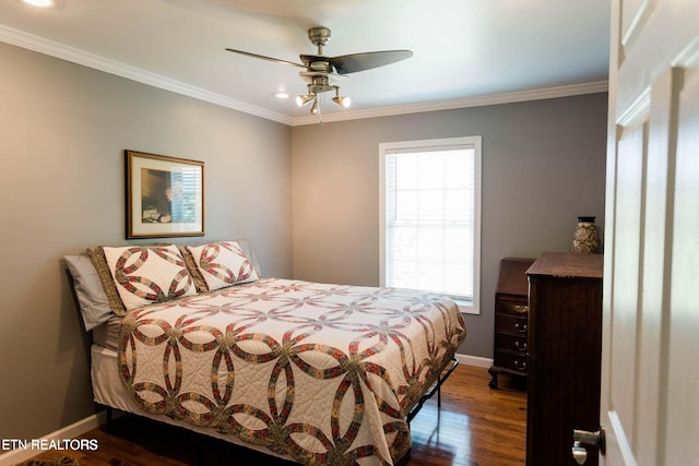 bedroom with dark wood finished floors, crown molding, a ceiling fan, and baseboards