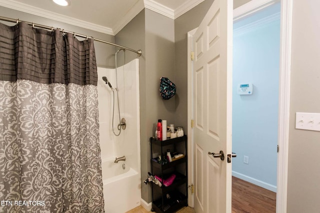 bathroom featuring wood finished floors, shower / bathtub combination with curtain, baseboards, and ornamental molding