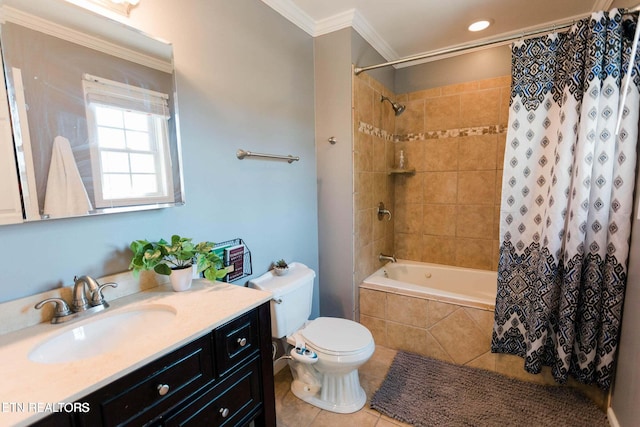 bathroom with vanity, tile patterned flooring, crown molding, toilet, and tiled shower / bath