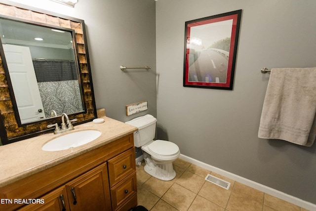 full bathroom featuring vanity, baseboards, visible vents, tile patterned floors, and toilet