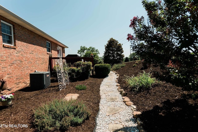 view of yard with central AC