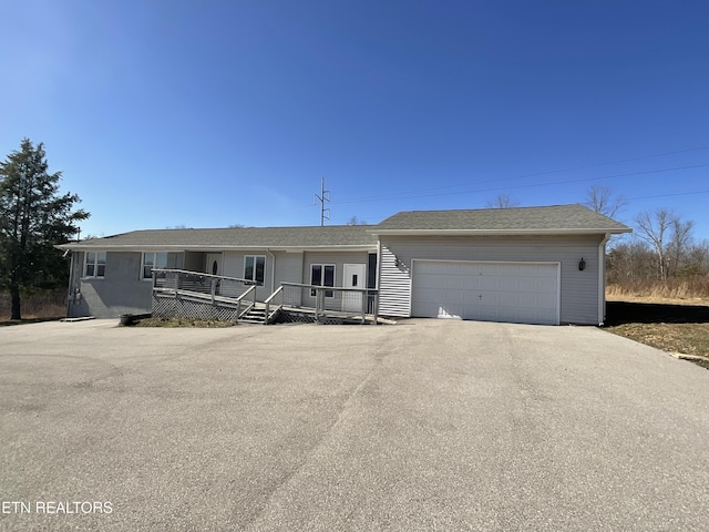 view of front facade with driveway and a garage