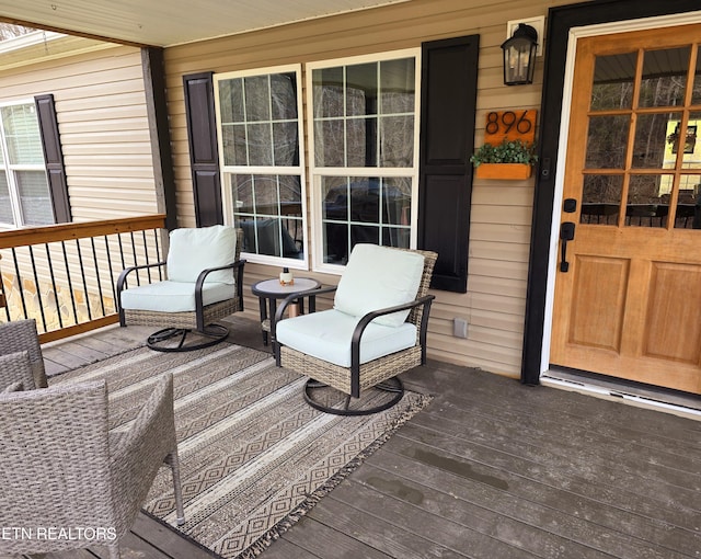 wooden deck featuring covered porch