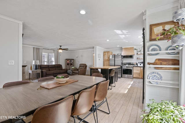 dining room with recessed lighting, light wood-type flooring, ceiling fan, and ornamental molding