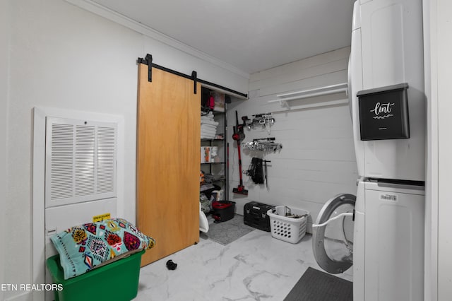 storage room featuring stacked washer and clothes dryer