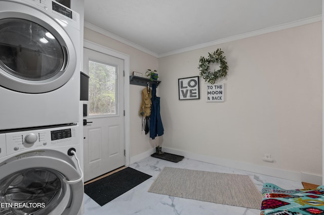 washroom with marble finish floor, stacked washing maching and dryer, crown molding, baseboards, and laundry area