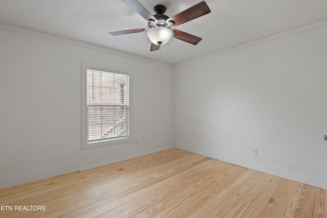 unfurnished room with ceiling fan, wood finished floors, baseboards, and ornamental molding