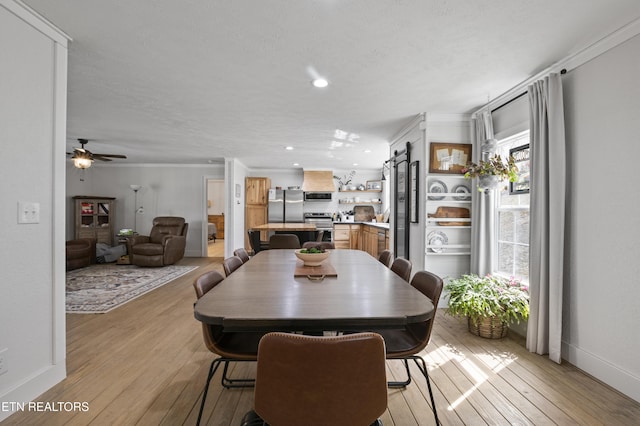 dining space featuring crown molding, baseboards, light wood-type flooring, recessed lighting, and a ceiling fan