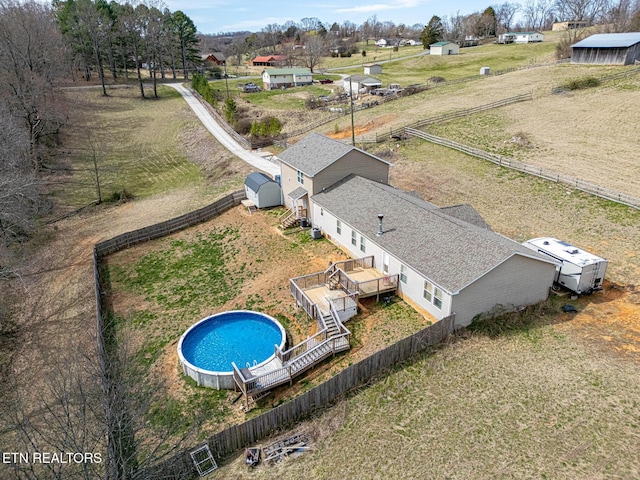 birds eye view of property featuring a rural view