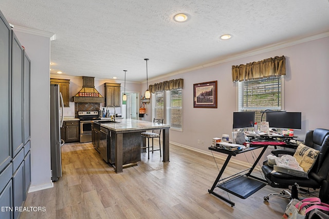 office space featuring baseboards, a sink, ornamental molding, light wood-style floors, and a textured ceiling