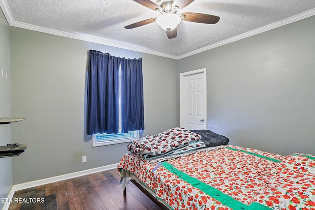 bedroom with ceiling fan, baseboards, hardwood / wood-style floors, and crown molding