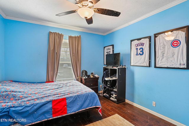 bedroom featuring a ceiling fan, crown molding, wood finished floors, and baseboards