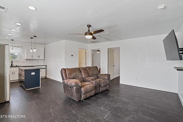 living room with visible vents, recessed lighting, baseboards, attic access, and ceiling fan