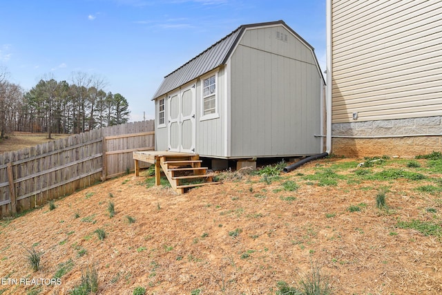 view of shed with a fenced backyard