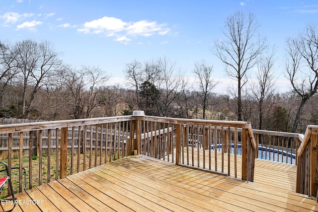 wooden deck featuring an outdoor pool