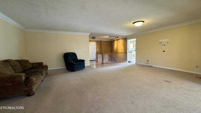 unfurnished living room with a textured ceiling, baseboards, carpet floors, and ornamental molding