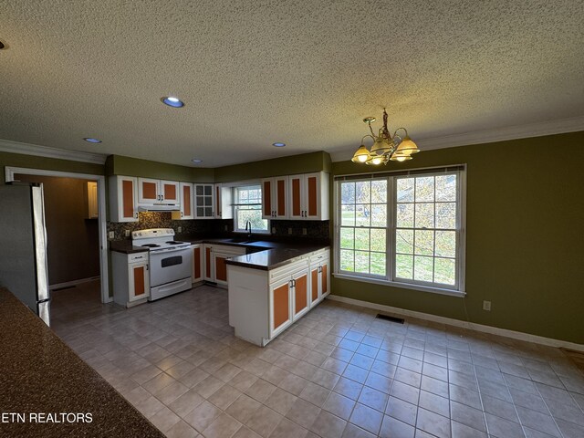 kitchen featuring an inviting chandelier, under cabinet range hood, white electric stove, visible vents, and freestanding refrigerator