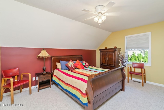 bedroom with visible vents, carpet floors, baseboards, ceiling fan, and vaulted ceiling