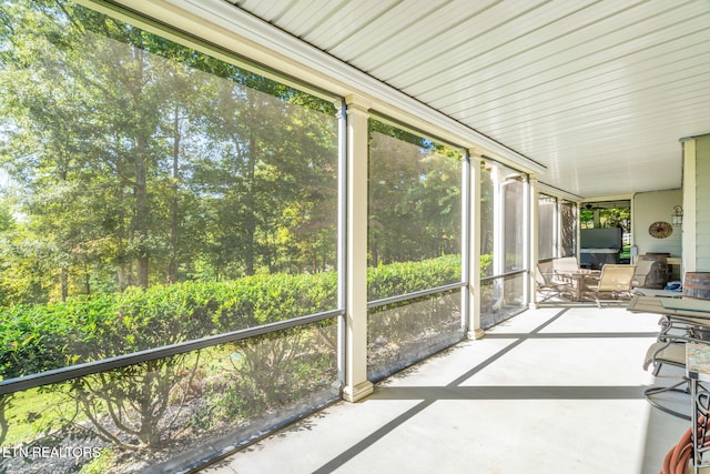 unfurnished sunroom featuring plenty of natural light