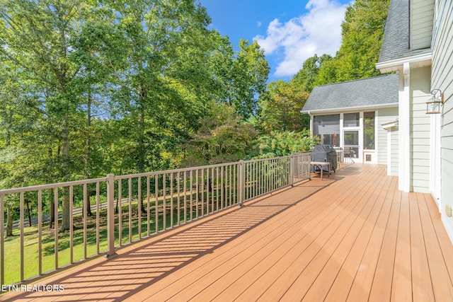 deck with a sunroom