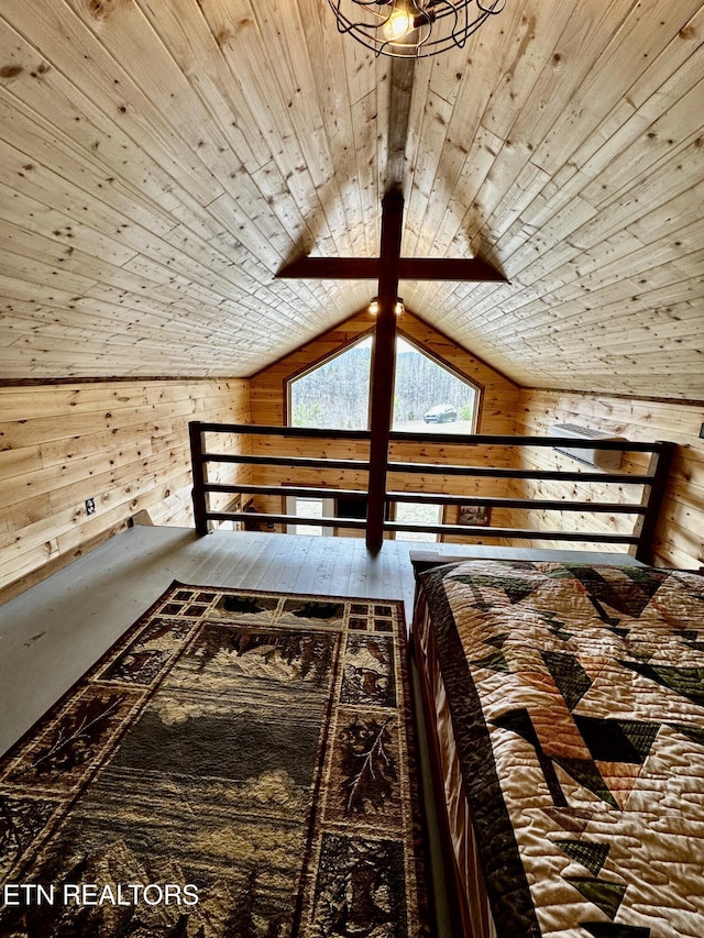 unfurnished bedroom with wooden walls, wood ceiling, and vaulted ceiling